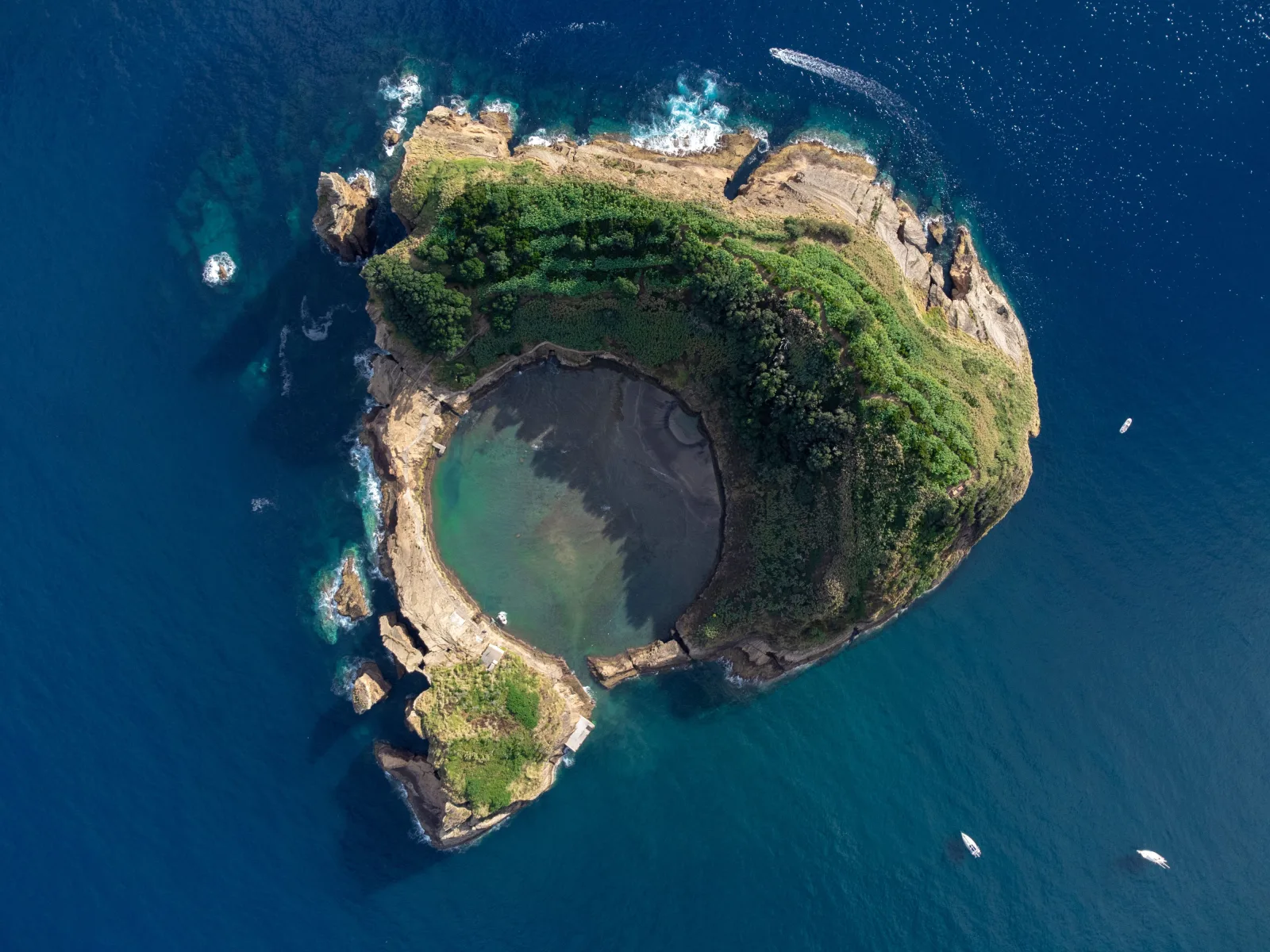 Aerial view of Ilhéu de Vila Franca do Campo — the circular volcanic crater islet off the south coast of São Miguel, Azores