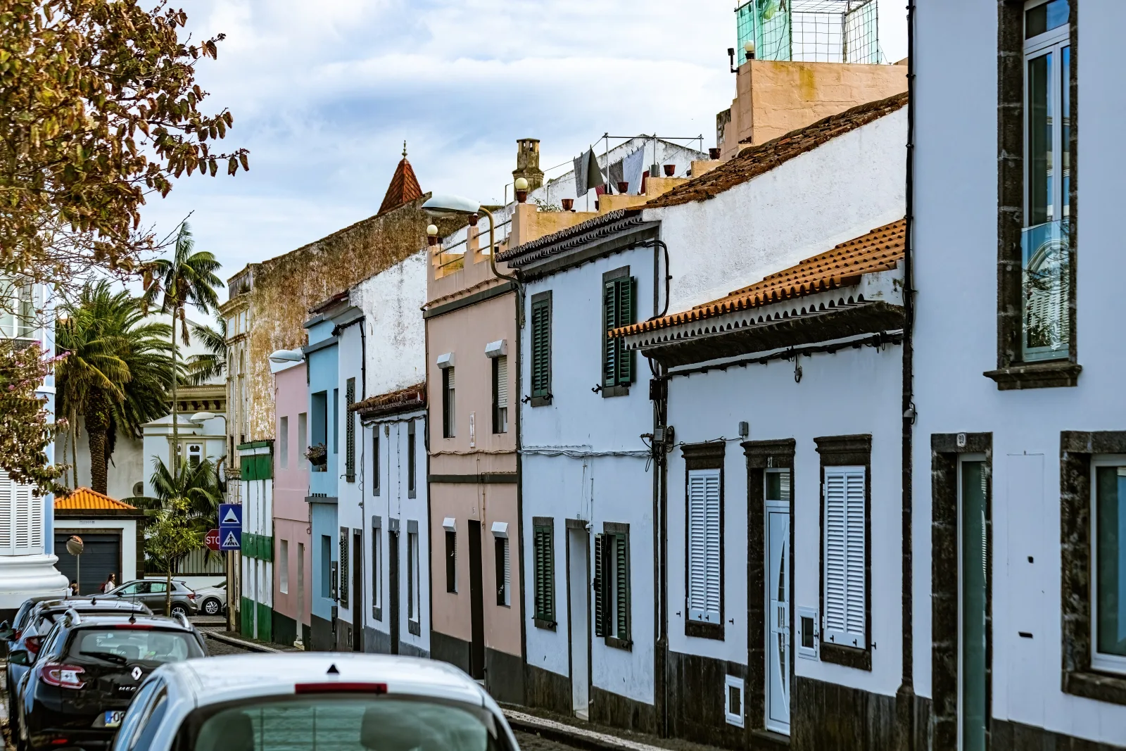 Cobblestone streets of central Ponta Delgada — the kind of route São Miguel processions follow, lined with petals and flower carpets, São Miguel, Azores